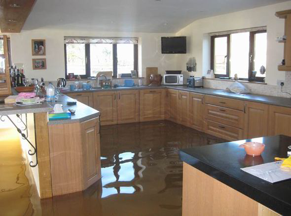 San Antonio home flooded with water in kitchen