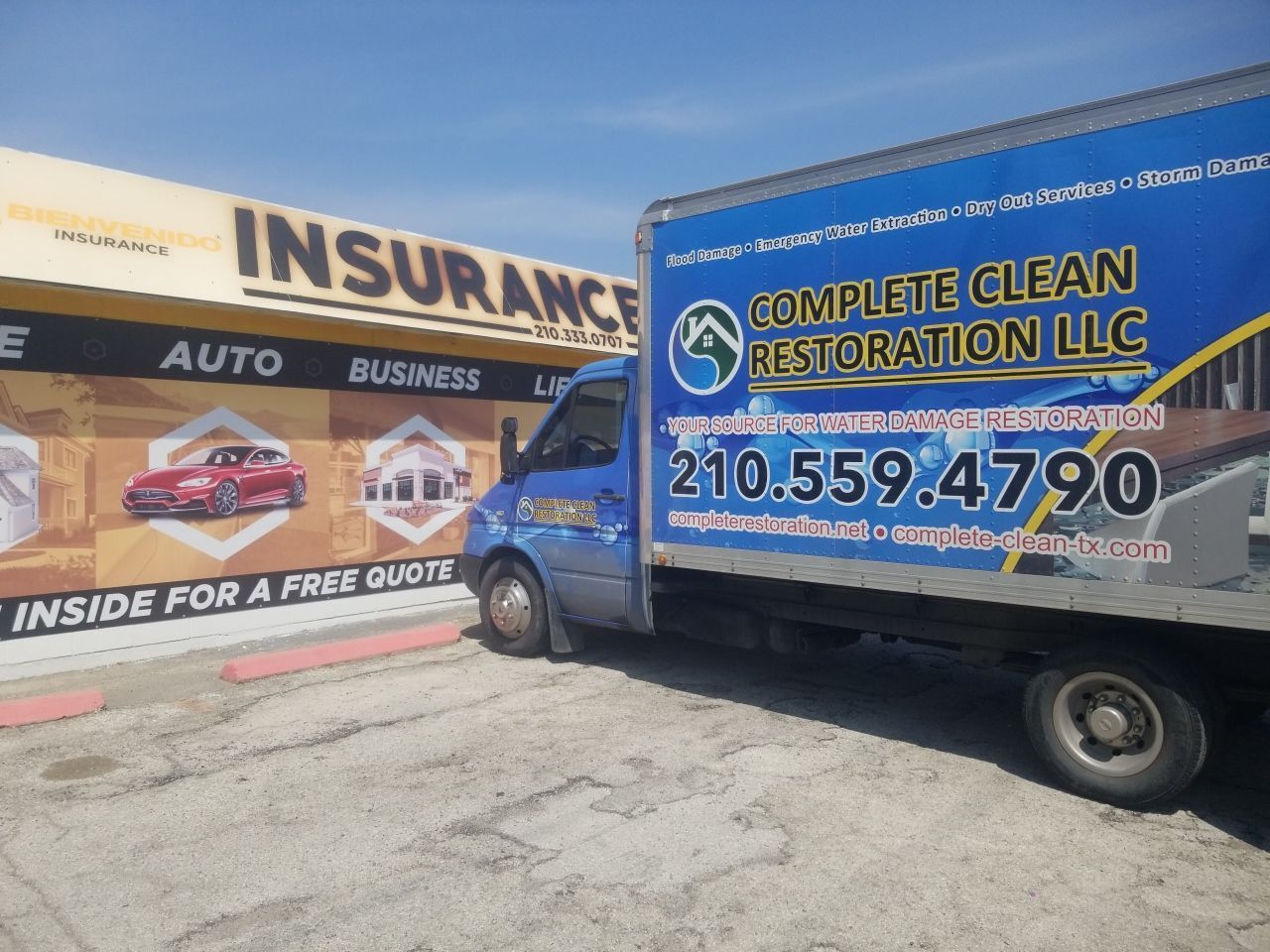 Commercial flood restoration truck in front of business