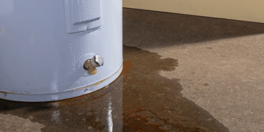 A appliance leak from a water heater with signs of rust and iron in the water