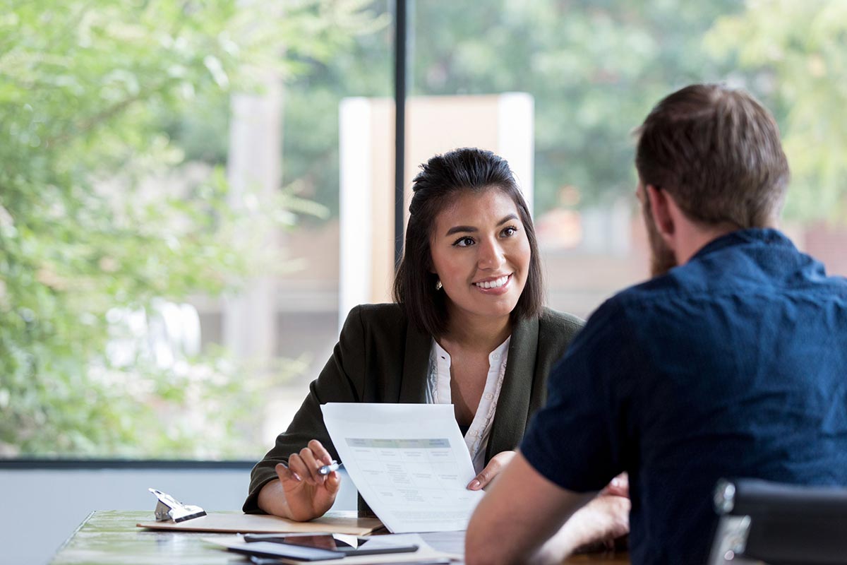 Insurance expert talking to customer