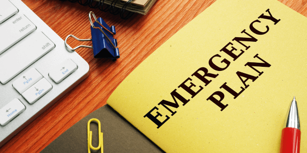 water damage Emergency plan or Disaster Preparedness on the desk.