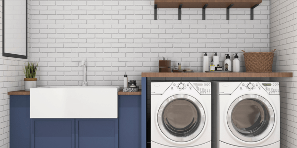 prevent laundry room water damage- washing machine and sink in stylish laundry room