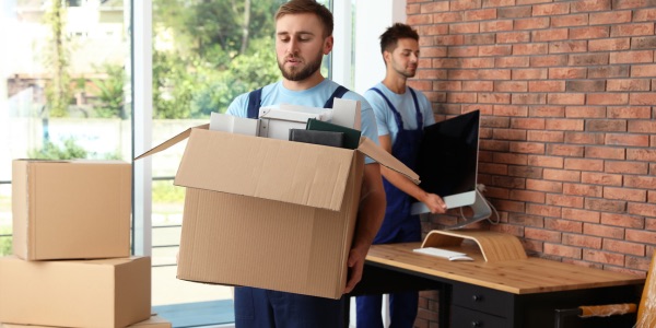 men moving boxes for emergency pack-up service